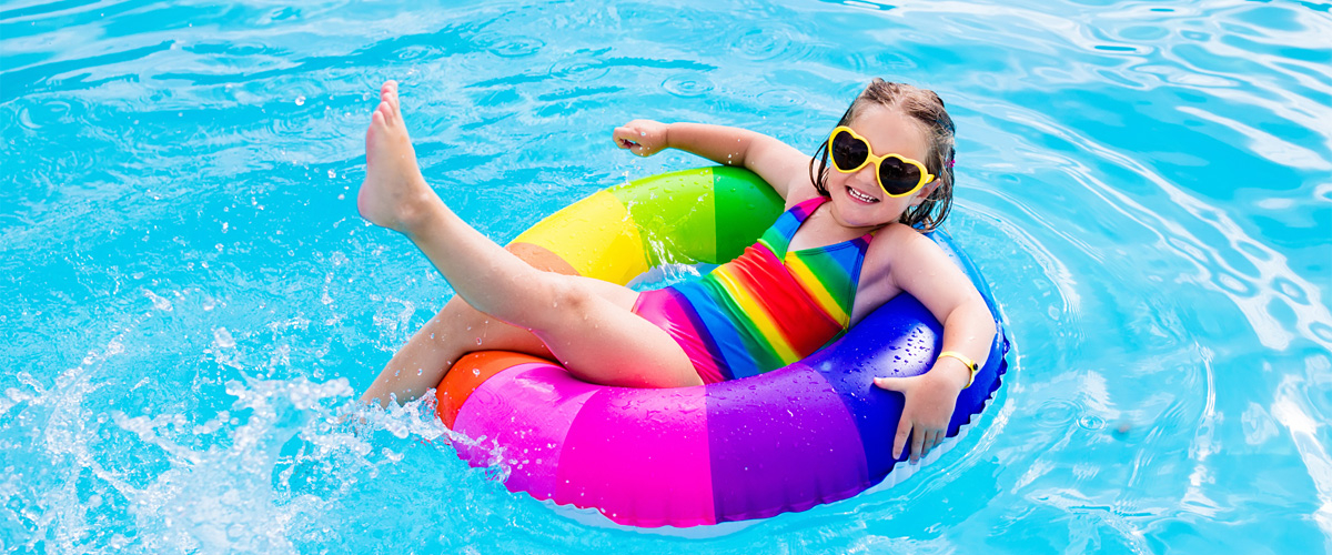 Child with swimming ring in the water